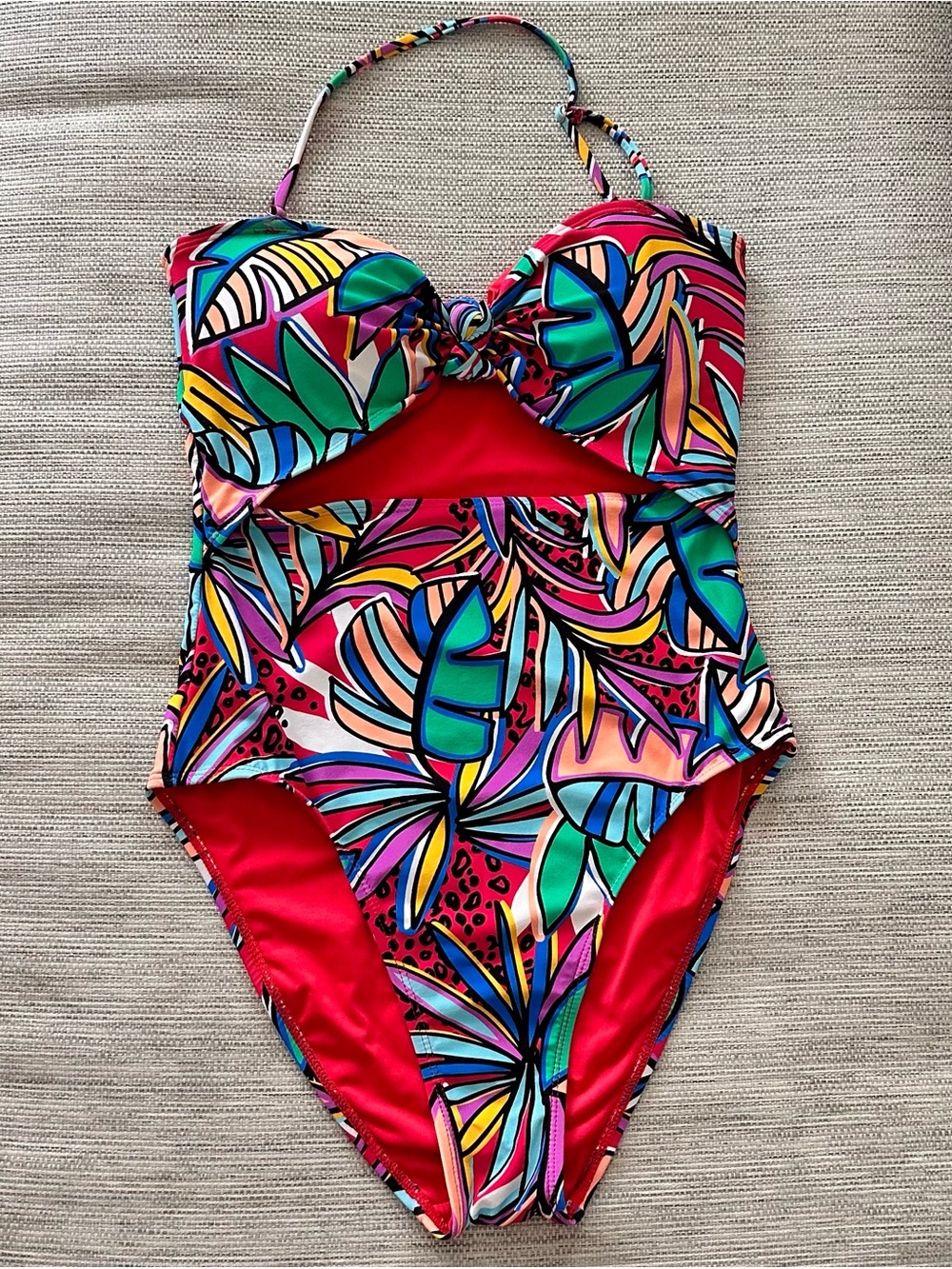 BCBGeneration women’s Tropical Cutout One-Piece Swimsuit in Pink, Green & Blue